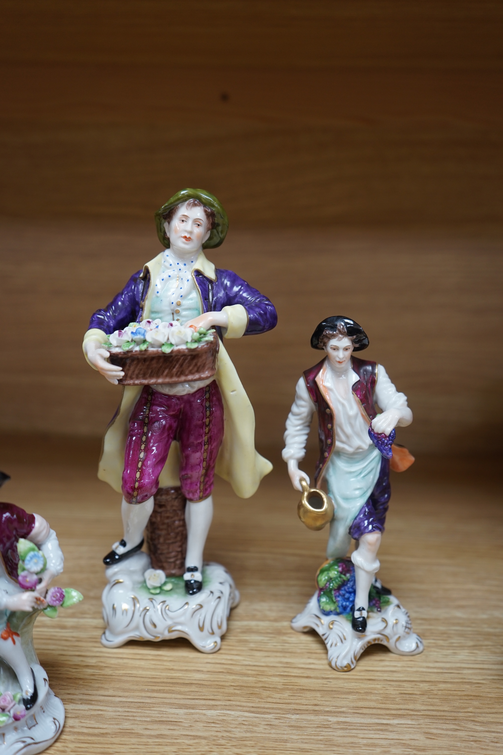 Five Continental figurines, three with Sitzendorf marks and two with crowned ‘K’s, tallest 22cm. Condition - good.